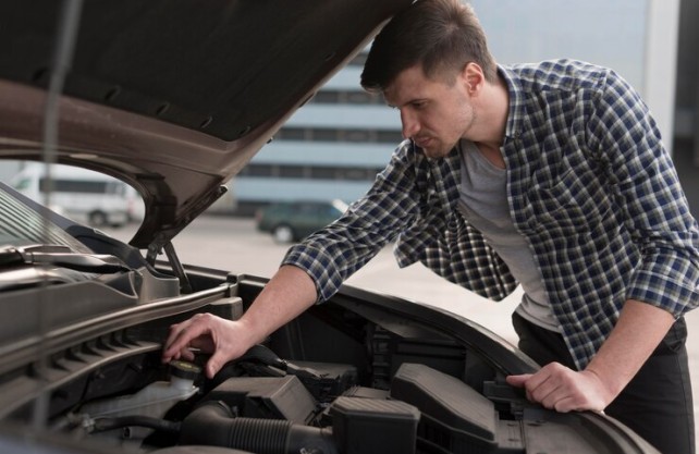 Complete Honda Car Maintenance Guide: Tips, Schedules & More Honda car maintenance checklist being reviewed by a mechanic